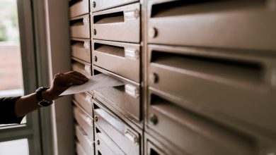 man pulling irs letter 6575 from the mailbox
